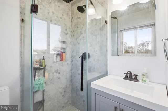 a bathroom with a sink and mirror