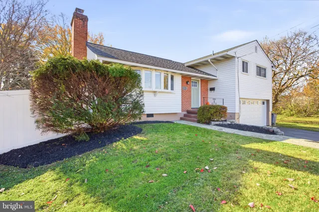 a front view of house with yard and seating area