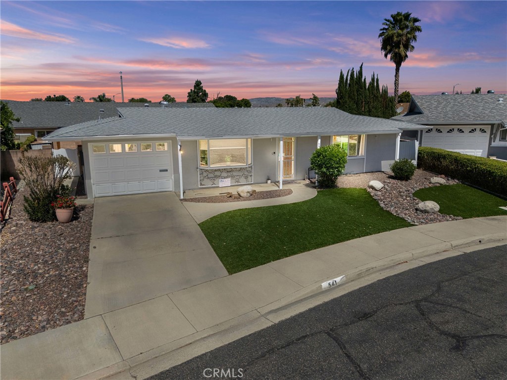 541 Shasta Way Hemet, CA 92543 - Photo 1 of 34 a view of a big house with a big yard and potted plants