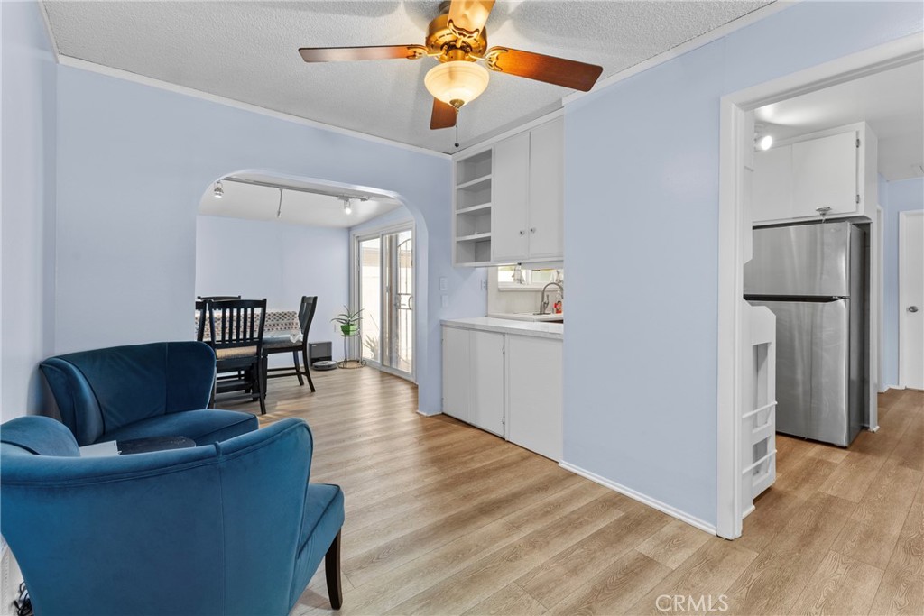 541 Shasta Way Hemet, CA 92543 - Photo 10 of 34 a living room with furniture and a chandelier