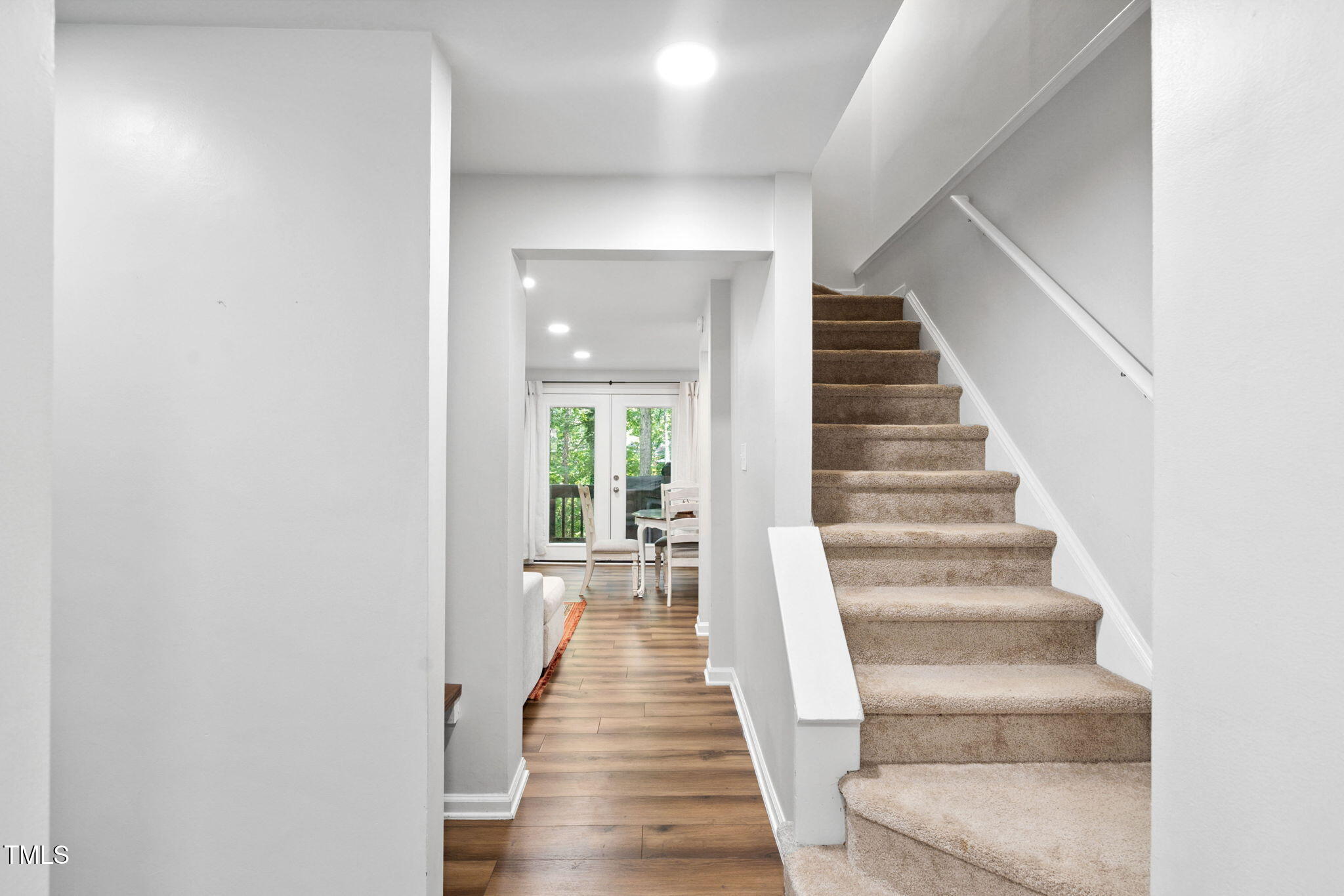 7286 Shellburne Drive Raleigh, NC 27612 - Photo 11 of 36 a view of entryway and hall with wooden floor