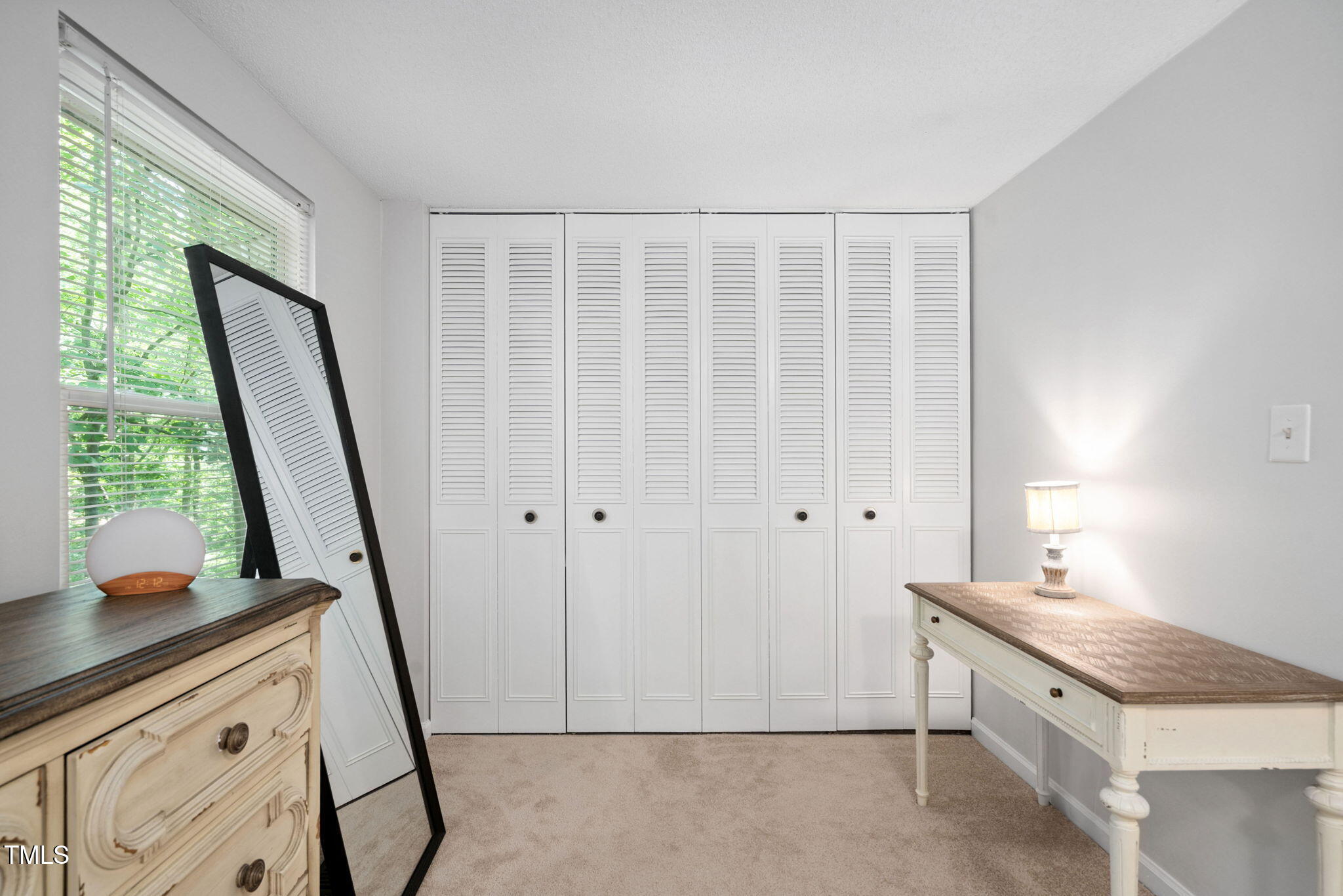 7286 Shellburne Drive Raleigh, NC 27612 - Photo 12 of 36 a spacious bathroom with a granite countertop sink a toilet a mirror and a window
