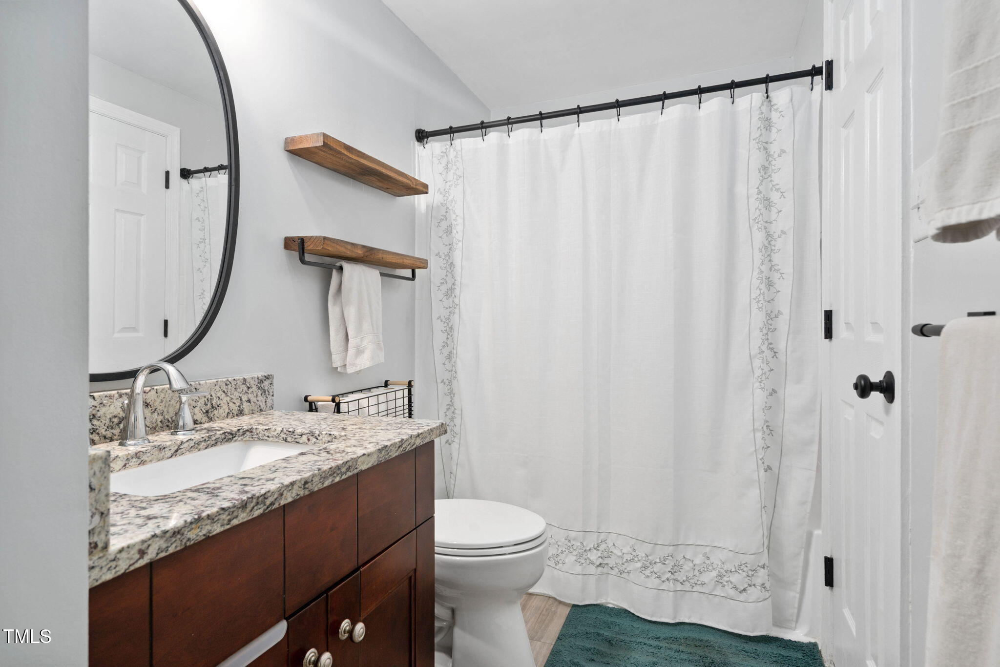 7286 Shellburne Drive Raleigh, NC 27612 - Photo 14 of 36 a bathroom with a granite countertop sink toilet and shower