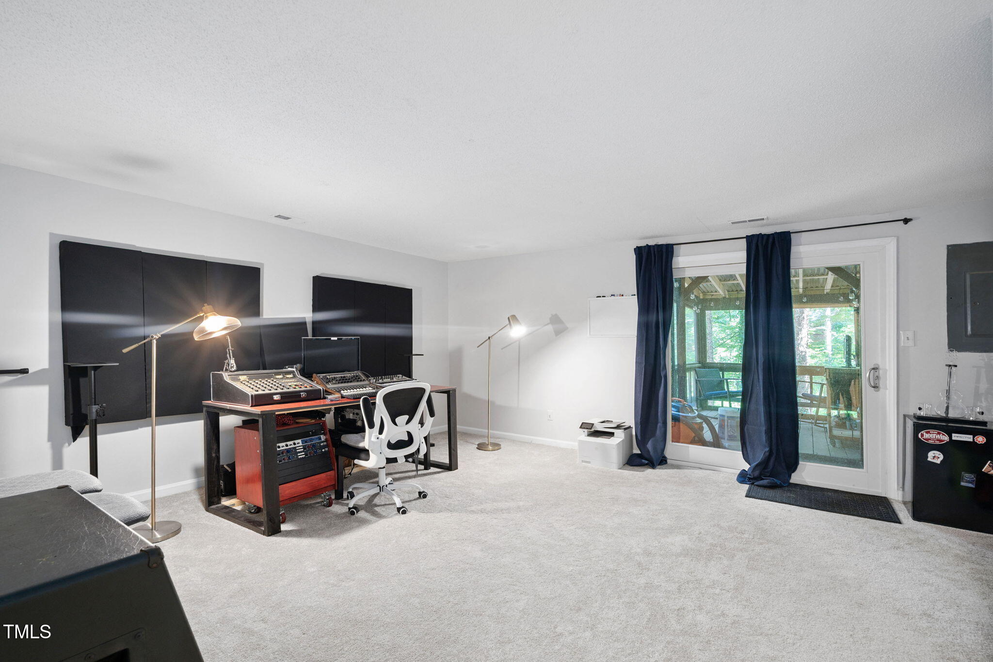 7286 Shellburne Drive Raleigh, NC 27612 - Photo 21 of 36 a view of a livingroom with furniture and a flat screen tv
