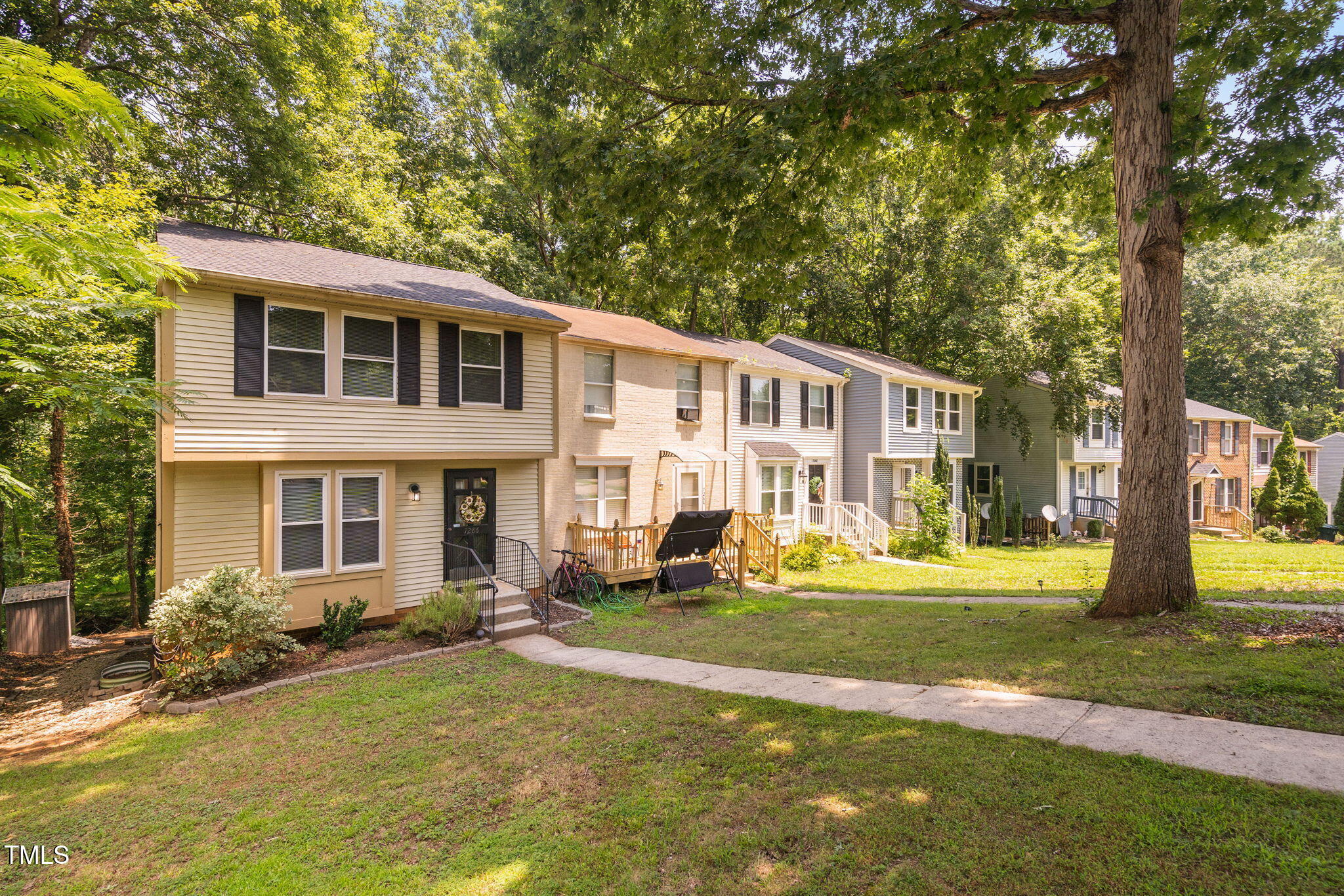 7286 Shellburne Drive Raleigh, NC 27612 - Photo 26 of 36 a view of a big yard with large trees and plants