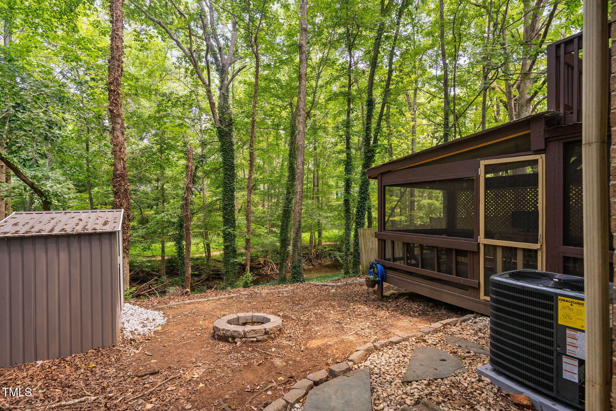 7286 Shellburne Drive Raleigh, NC 27612 - Photo 29 of 36 a backyard of a house with barbeque oven and wooden fence