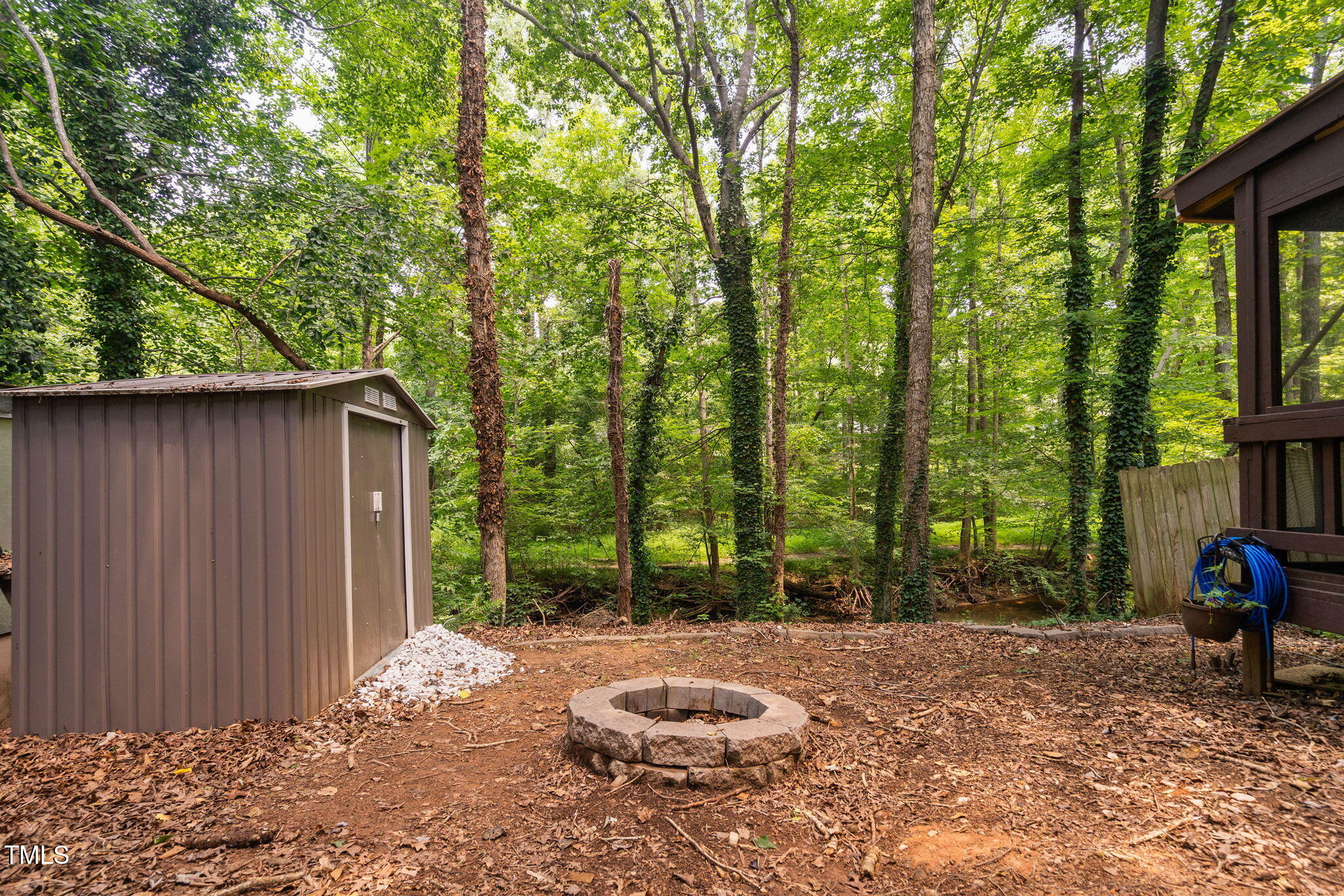 7286 Shellburne Drive Raleigh, NC 27612 - Photo 30 of 36 a backyard of a house with barbeque oven
