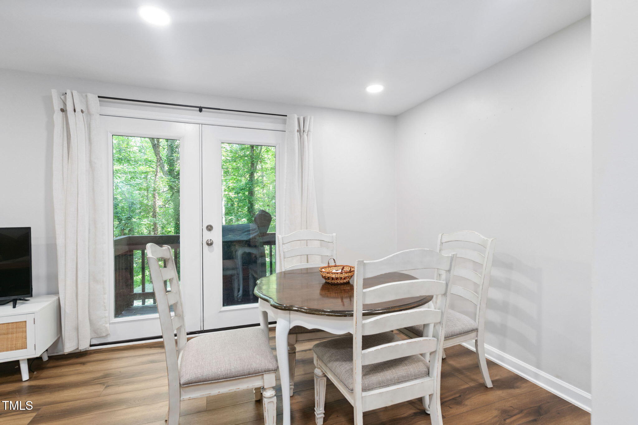 7286 Shellburne Drive Raleigh, NC 27612 - Photo 7 of 36 a view of a workspace with furniture and a window