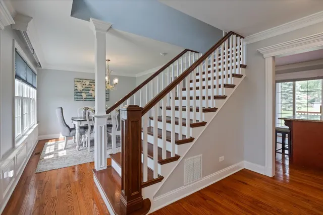a view of entryway with wooden floor and stairs