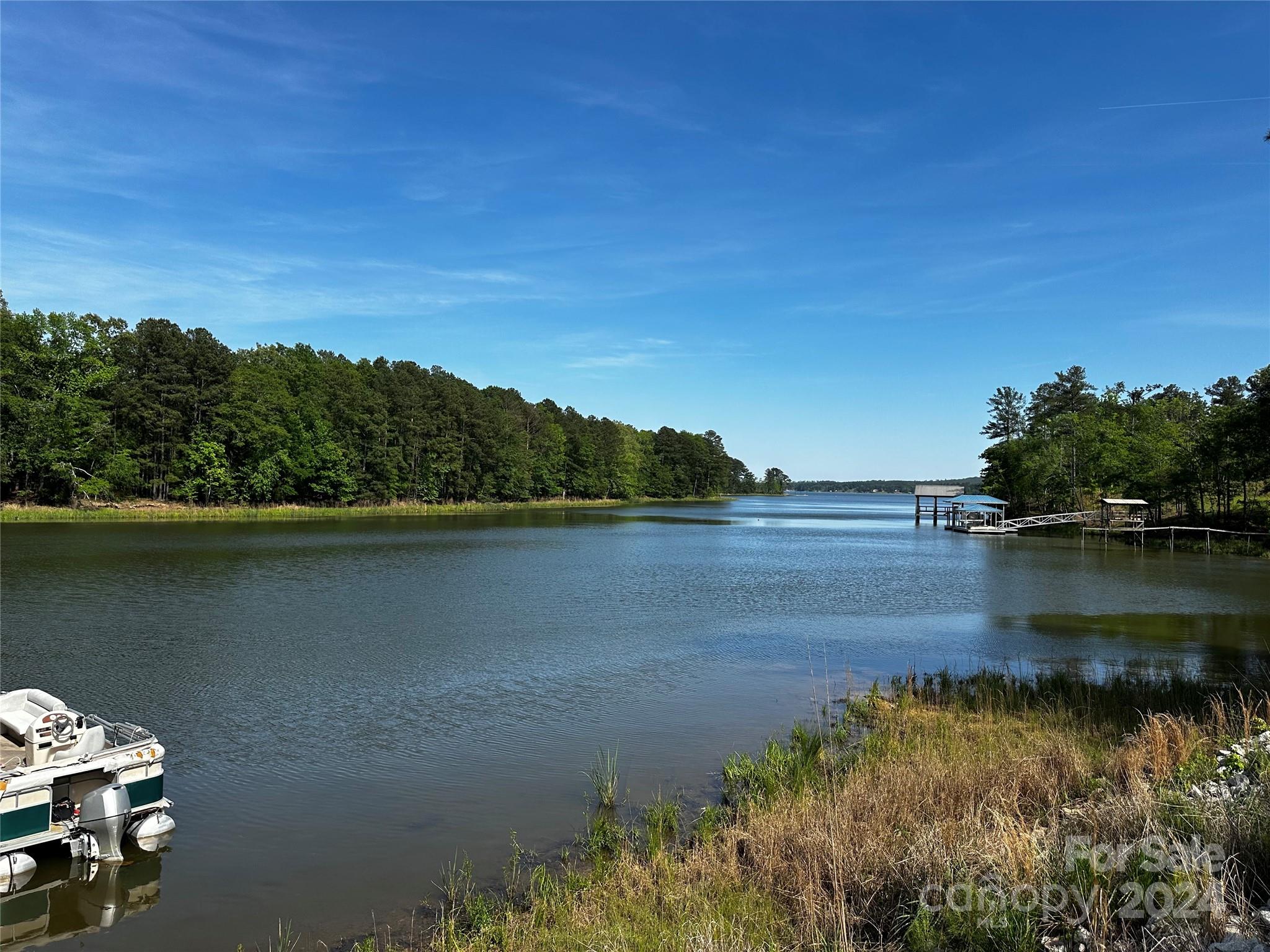 759 Retreat Way Ridgeway, SC 29130 - Photo 4 of 25 a view of a lake with houses
