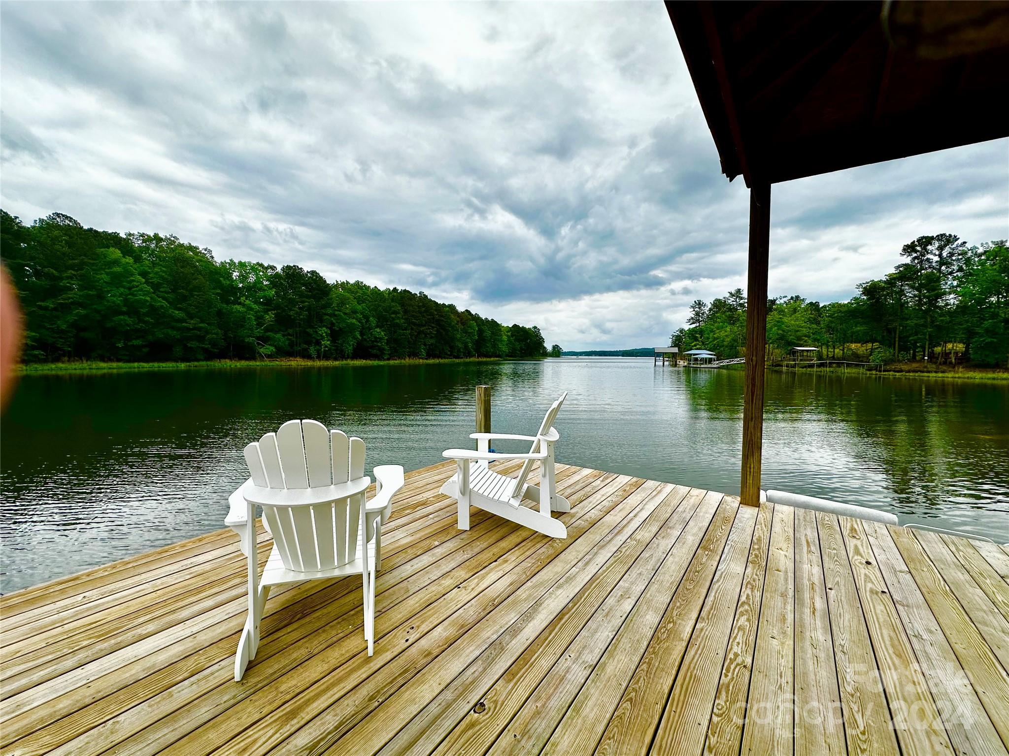 759 Retreat Way Ridgeway, SC 29130 - Photo 7 of 25 a lake view with a wooden deck and lake view