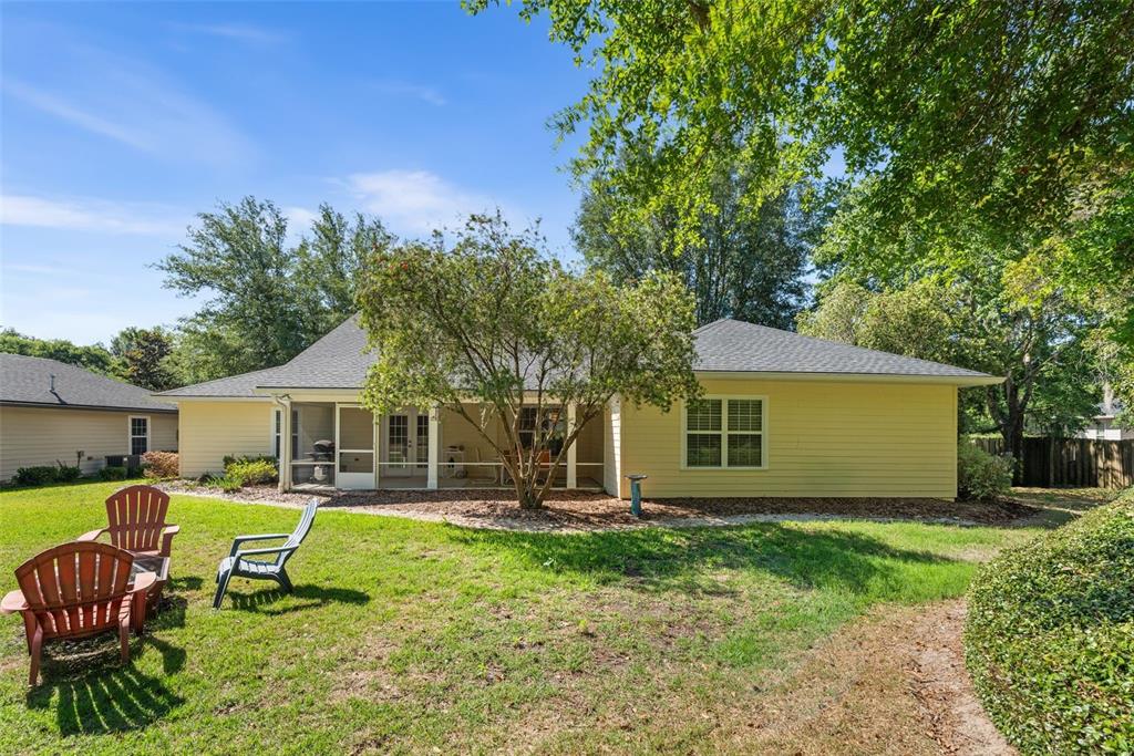7418 White Oaks Road Alachua, FL 32615 - Photo 35 of 46 a front view of house with a garden and sitting area