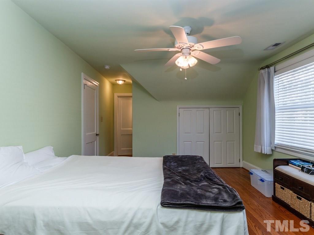 2715 Kilgore Avenue Raleigh, NC 27607 - Photo 12 of 25 a large bedroom with bed and window