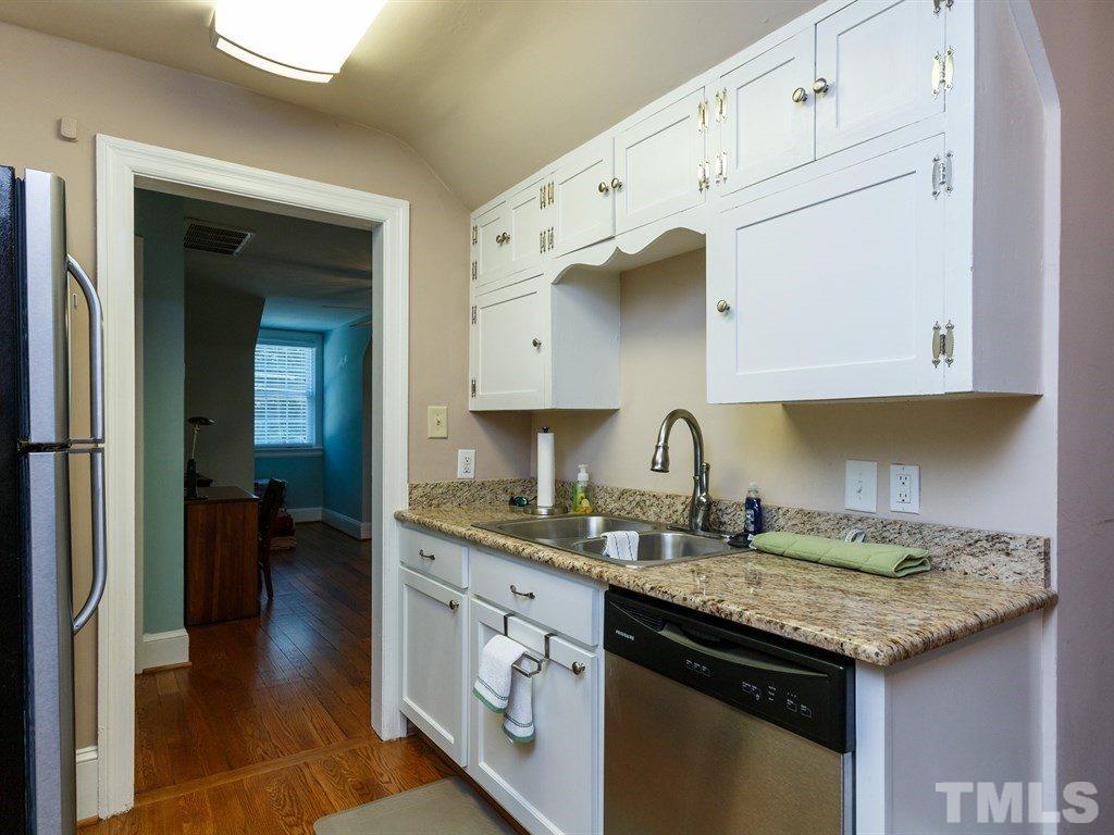 2715 Kilgore Avenue Raleigh, NC 27607 - Photo 16 of 25 a kitchen with granite countertop a sink stove and cabinets