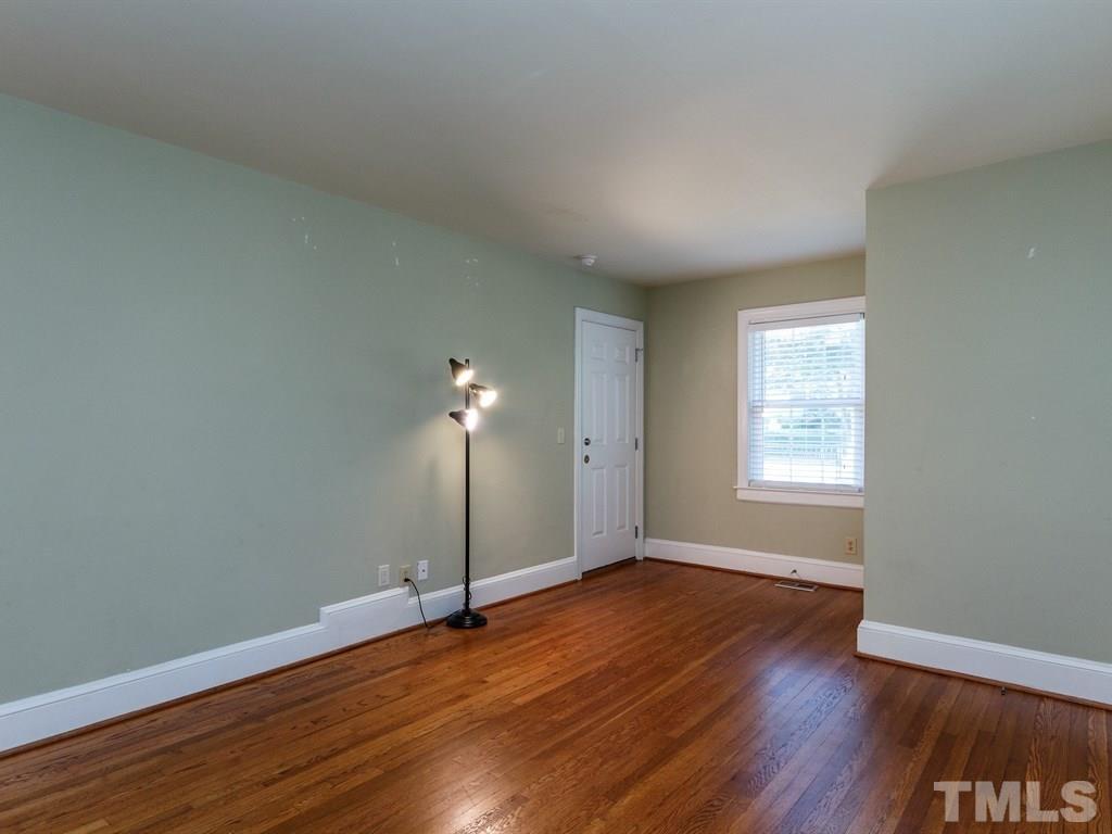 2715 Kilgore Avenue Raleigh, NC 27607 - Photo 18 of 25 an empty room with wooden floor and windows