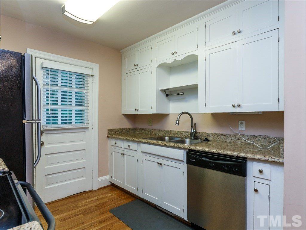 2715 Kilgore Avenue Raleigh, NC 27607 - Photo 19 of 25 a kitchen with granite countertop white cabinets and a sink