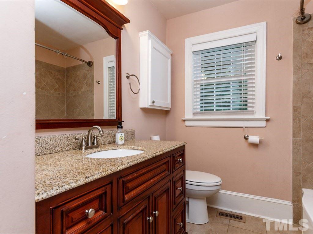 2715 Kilgore Avenue Raleigh, NC 27607 - Photo 21 of 25 a bathroom with a granite countertop toilet sink and mirror