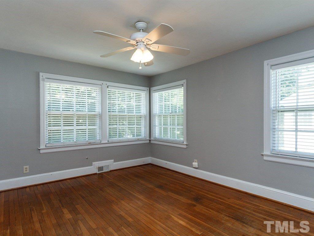 2715 Kilgore Avenue Raleigh, NC 27607 - Photo 7 of 25 a view of an empty room with wooden floor and a window