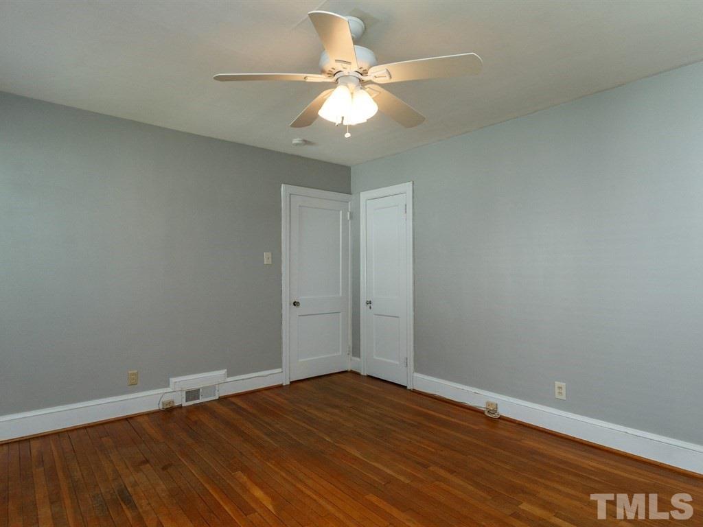 2715 Kilgore Avenue Raleigh, NC 27607 - Photo 8 of 25 a view of an empty room with wooden floor