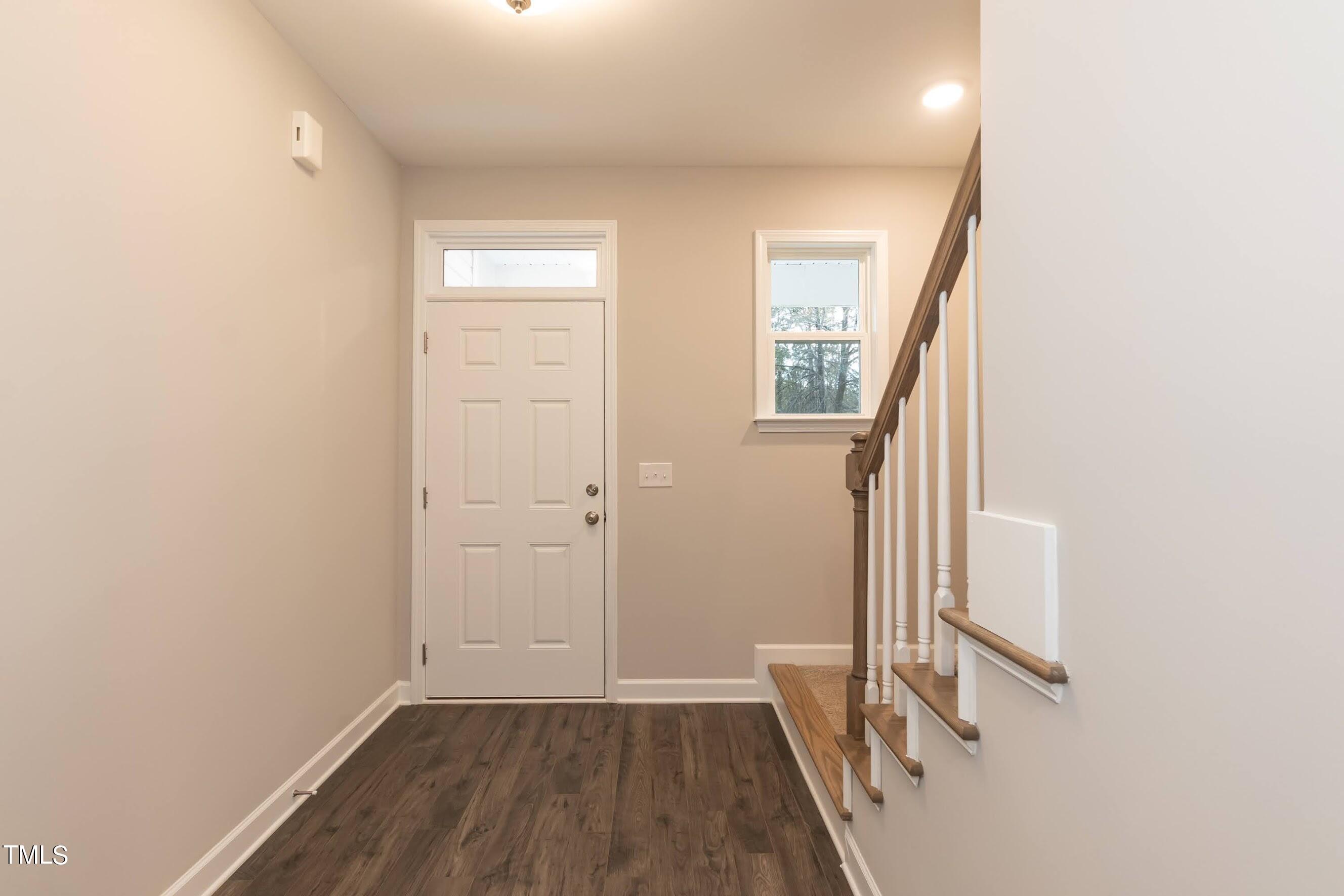 500 Poplar Springs Church Road Raleigh, NC 27603 - Photo 12 of 36 an entryway of a house with wooden floor