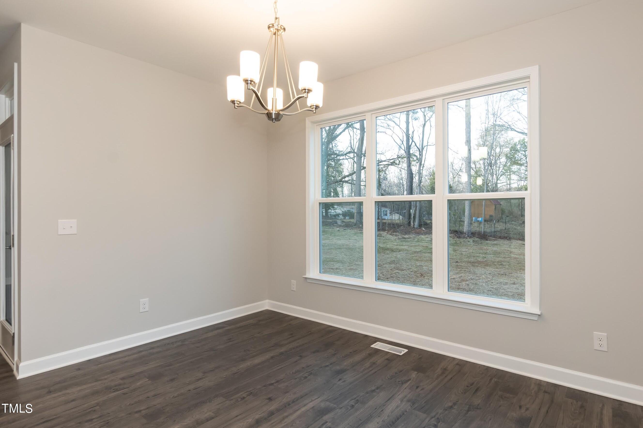 500 Poplar Springs Church Road Raleigh, NC 27603 - Photo 18 of 36 wooden floor in an empty room with a window