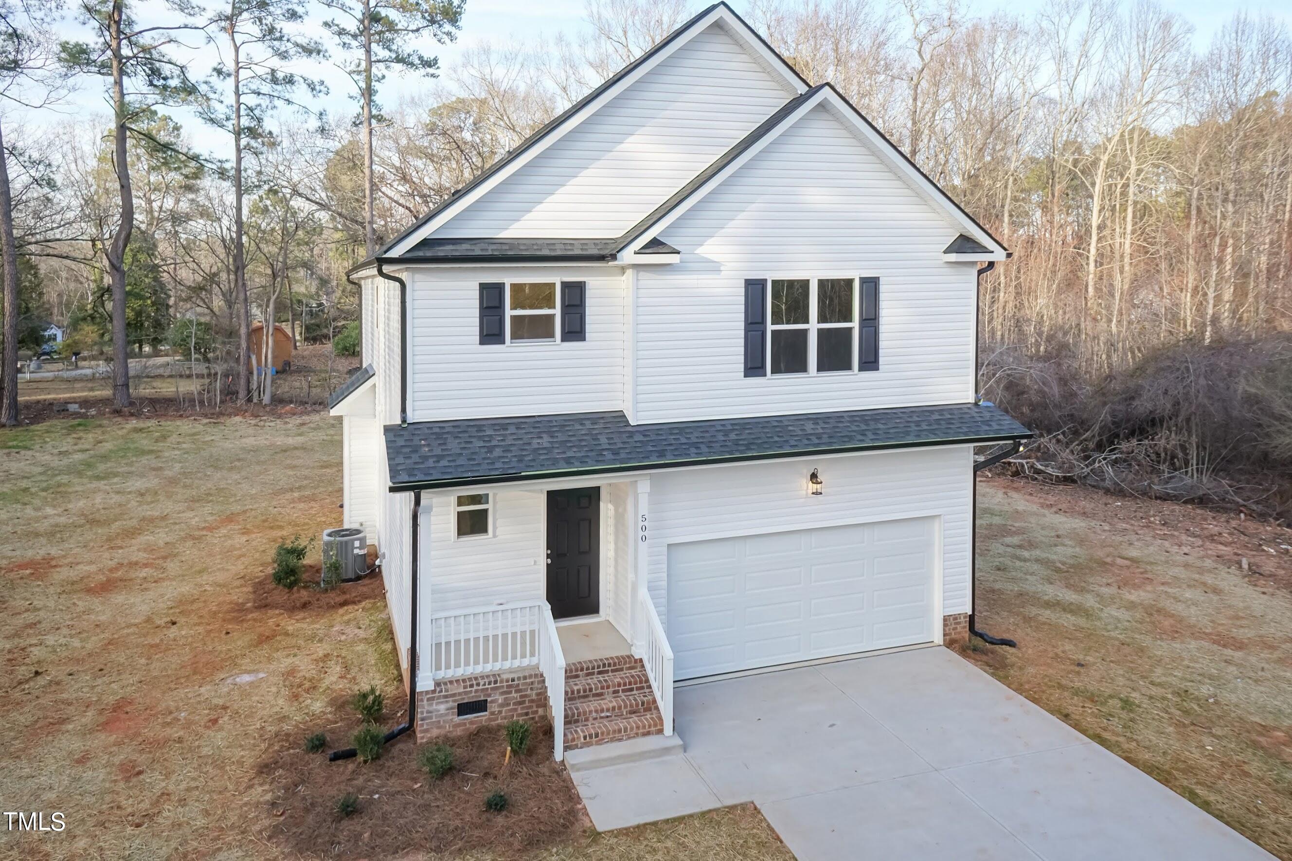 500 Poplar Springs Church Road Raleigh, NC 27603 - Photo 2 of 36 a house view with a outdoor space