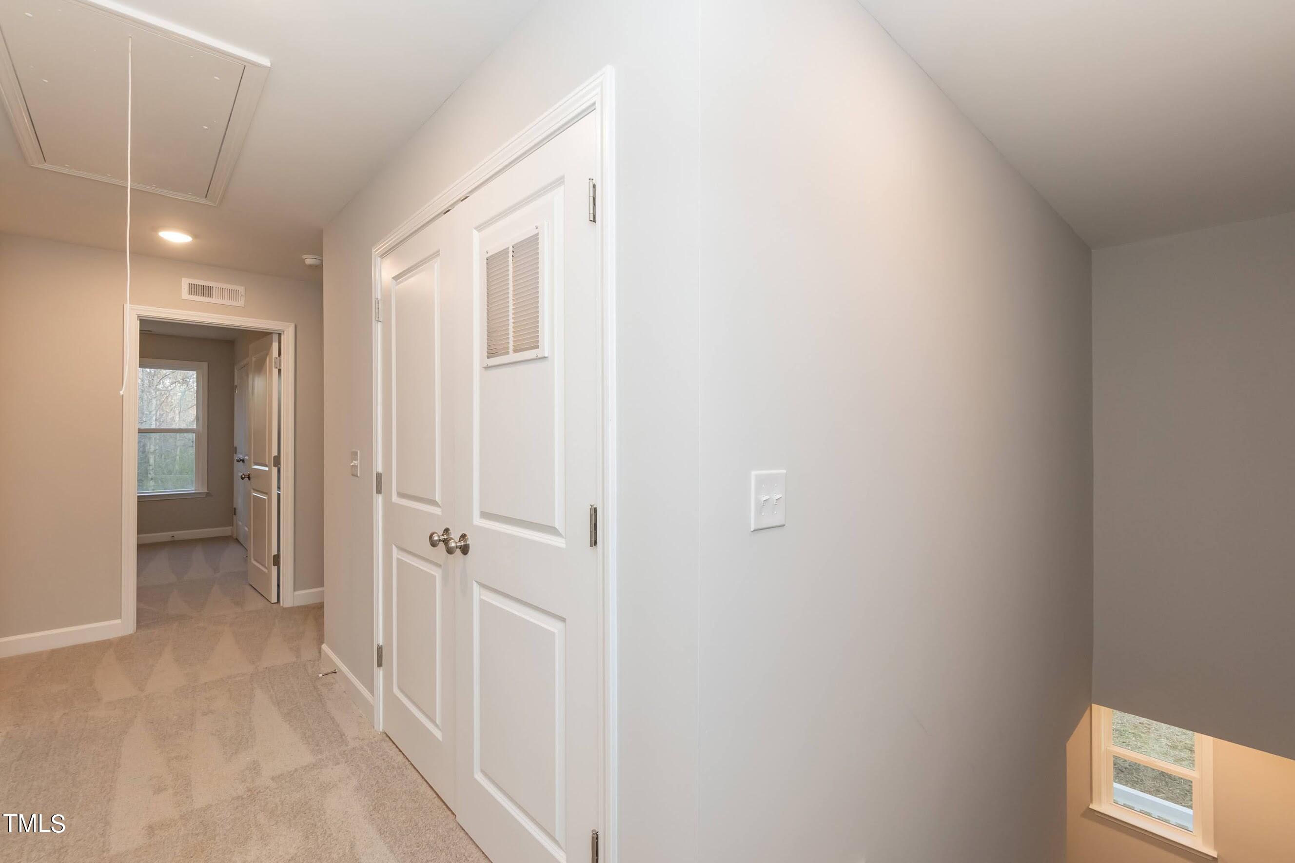 500 Poplar Springs Church Road Raleigh, NC 27603 - Photo 23 of 36 a view of a hallway with closet and bathroom