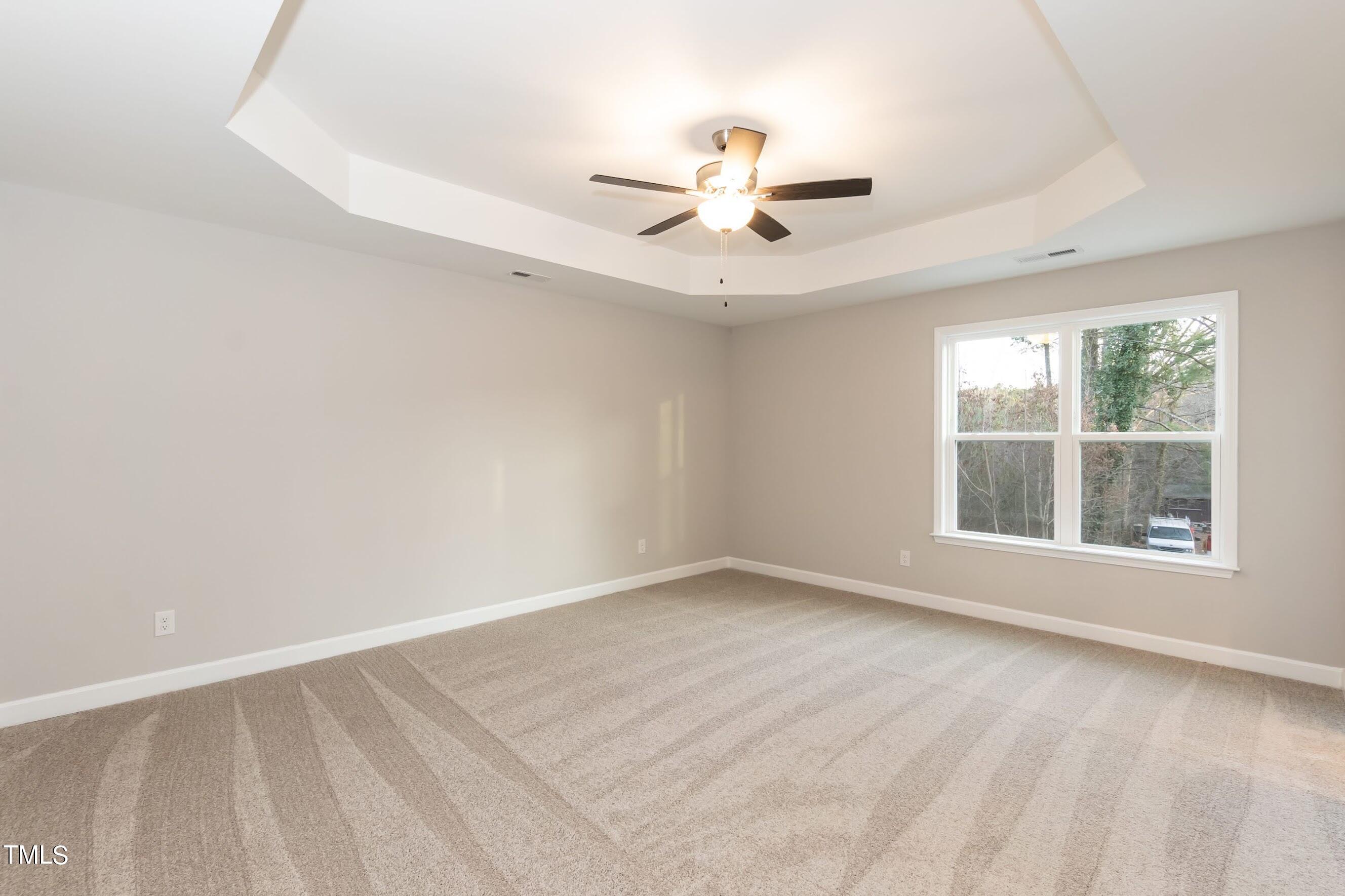 500 Poplar Springs Church Road Raleigh, NC 27603 - Photo 25 of 36 an empty room with windows and fan