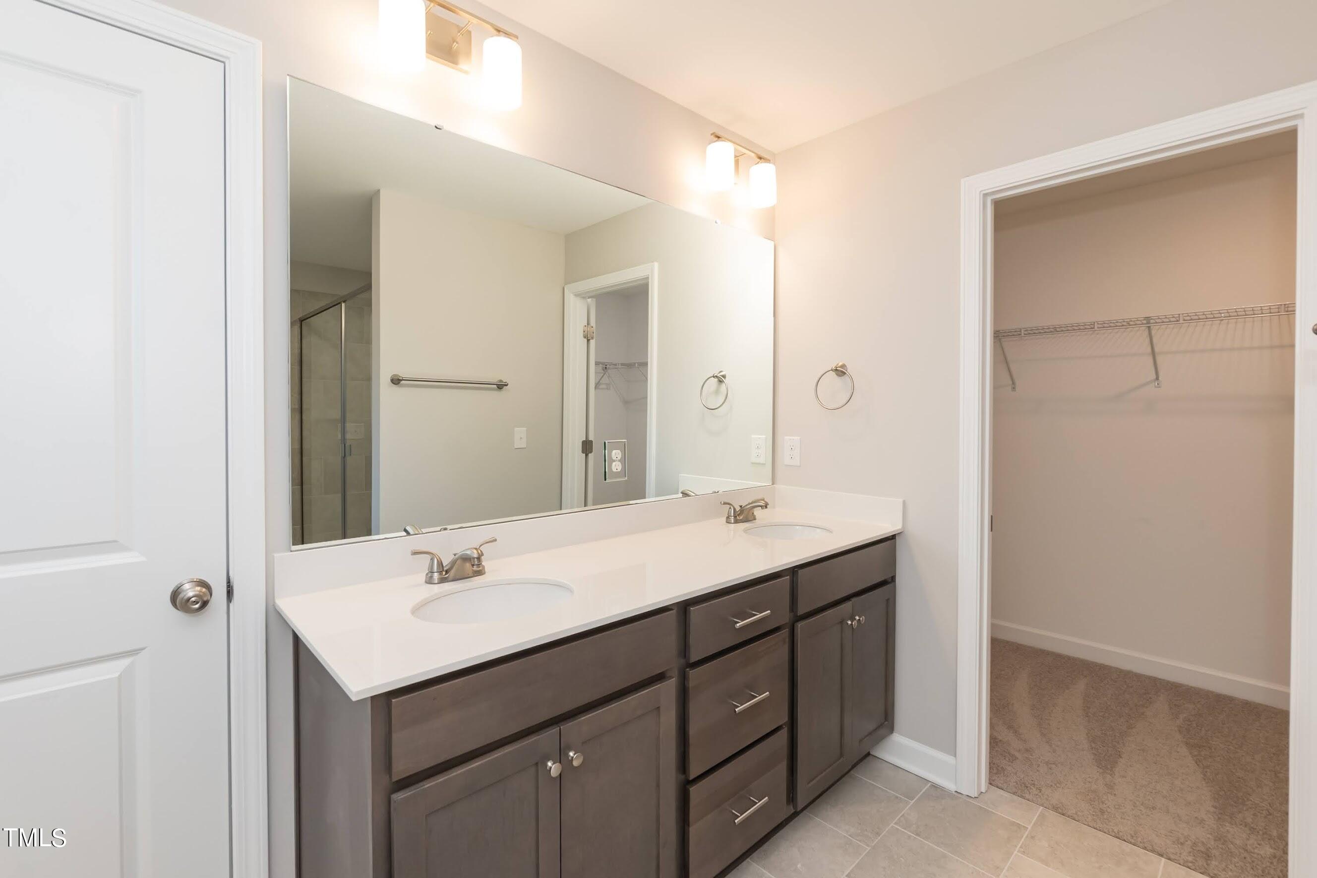 500 Poplar Springs Church Road Raleigh, NC 27603 - Photo 28 of 36 a bathroom with a sink and a mirror