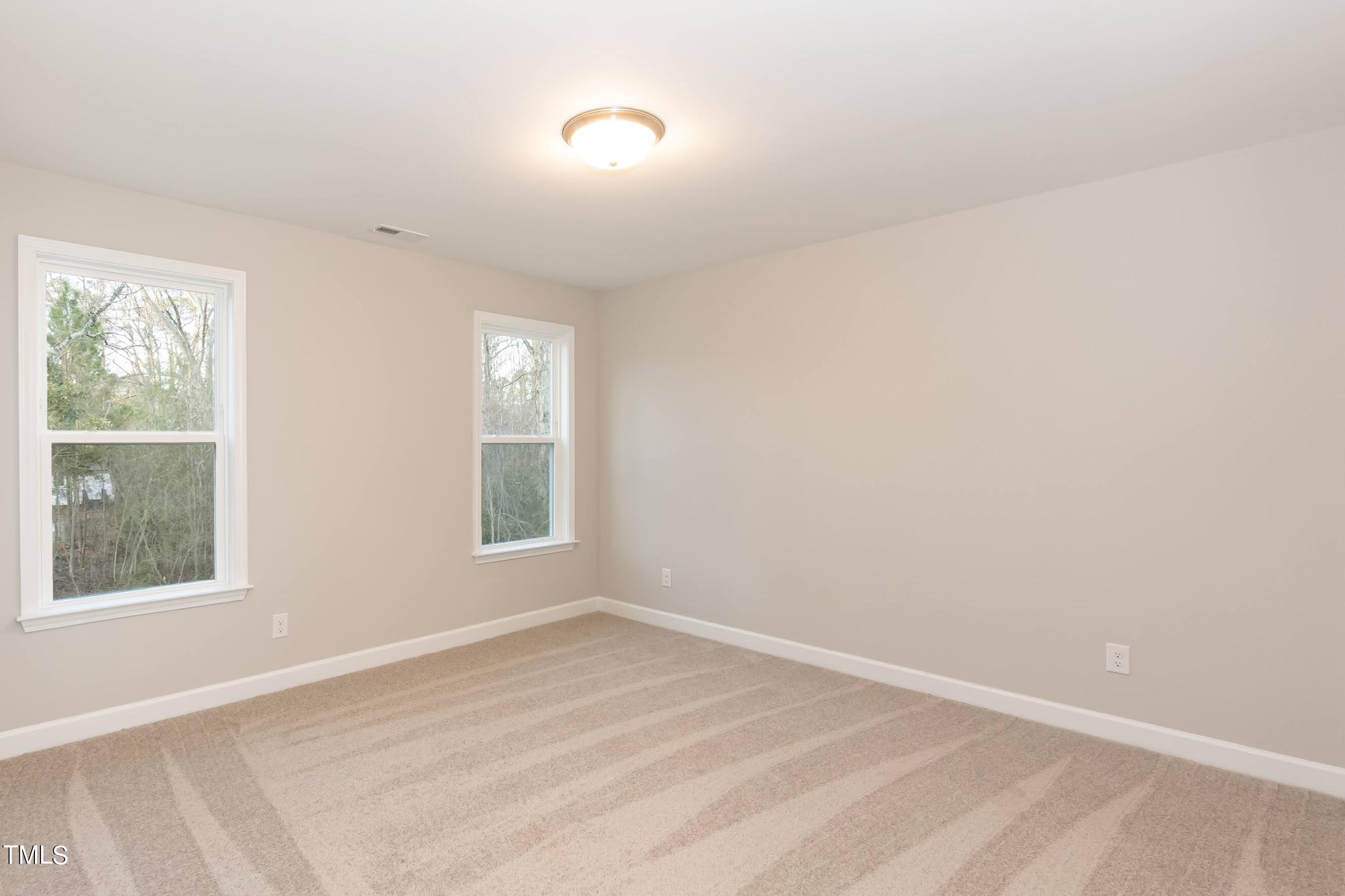500 Poplar Springs Church Road Raleigh, NC 27603 - Photo 32 of 36 a view of an empty room with a window