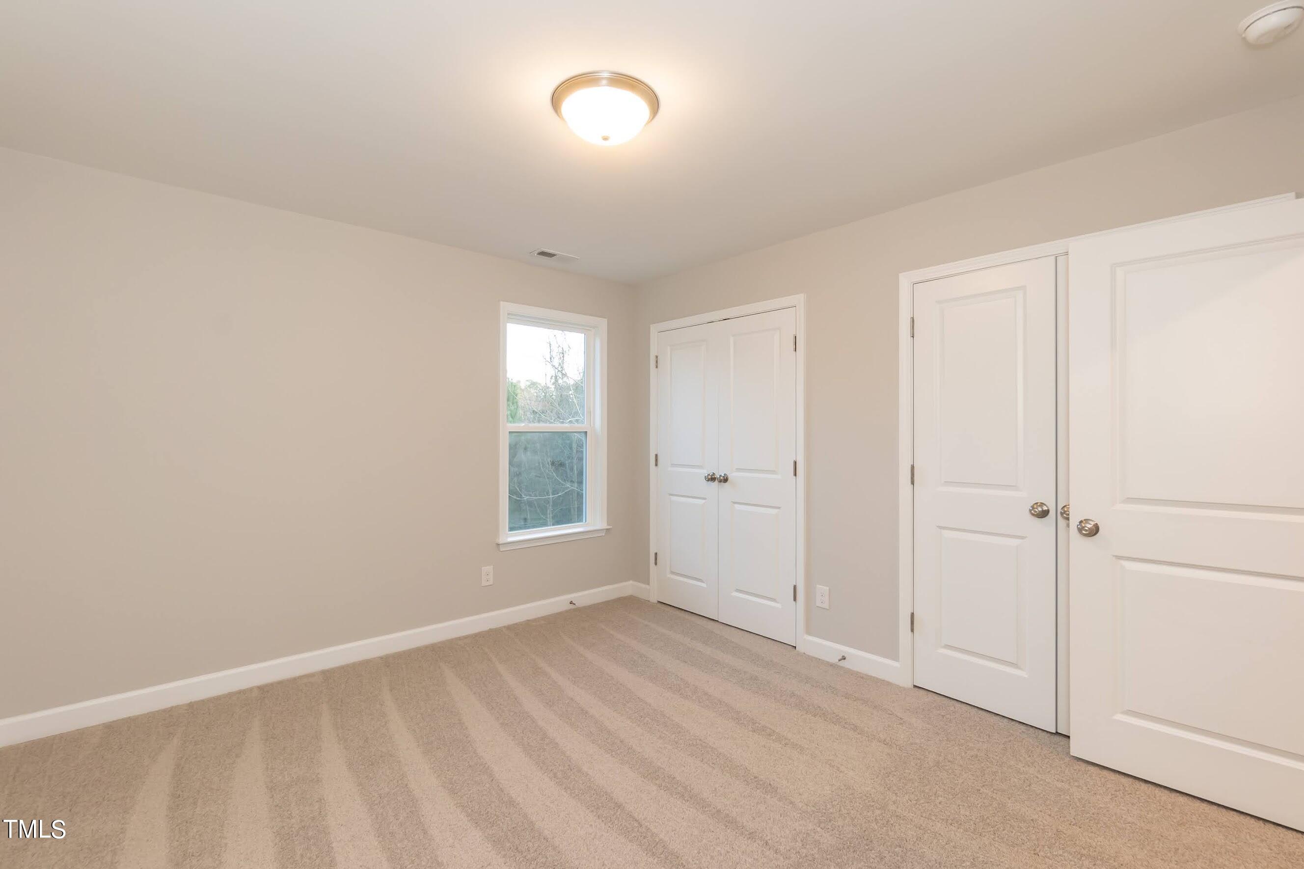500 Poplar Springs Church Road Raleigh, NC 27603 - Photo 33 of 36 a view of an empty room and window