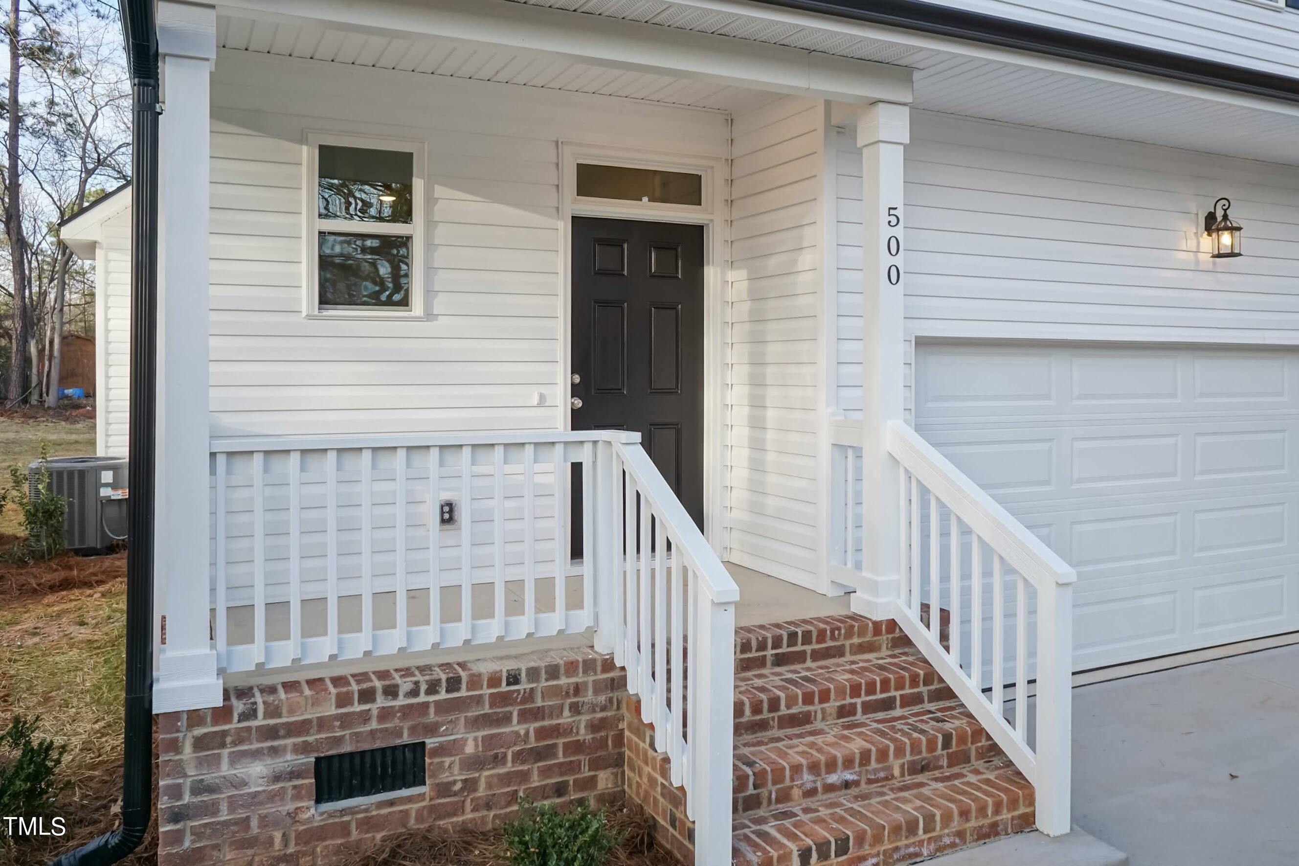 500 Poplar Springs Church Road Raleigh, NC 27603 - Photo 5 of 36 a view of balcony with wooden floor and fence