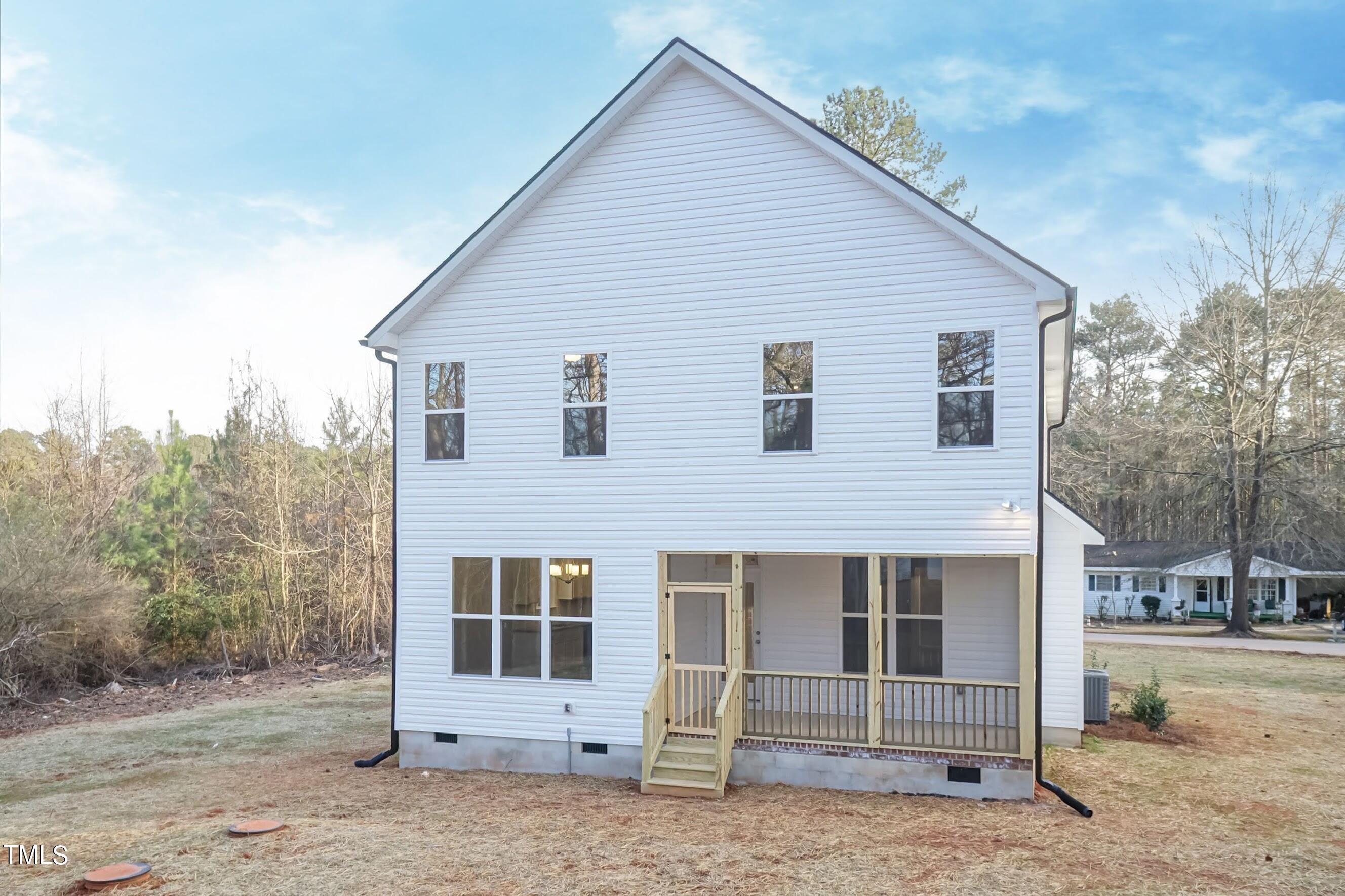 500 Poplar Springs Church Road Raleigh, NC 27603 - Photo 6 of 36 a front view of a house with a yard