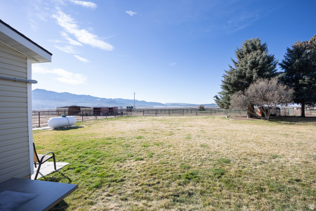 1981 South Main Street Lewiston, UT 84320 - Photo 26 of 47 View of yard featuring a mountain view and a view of rural / pastoral area