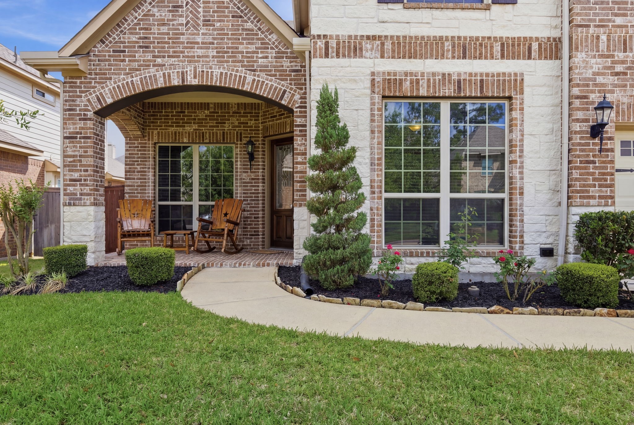24534 Jenns Creek Court Spring, TX 77389 - Photo 2 of 31 a front view of a building with garden