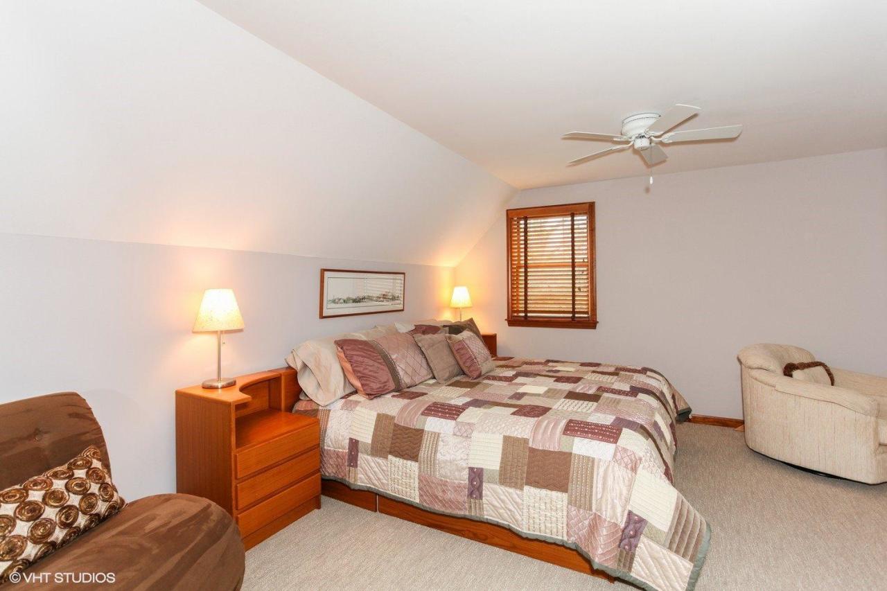74 Oval Road Chatham, MA 02633 - Photo 11 of 16 a bedroom with a bed and a couch