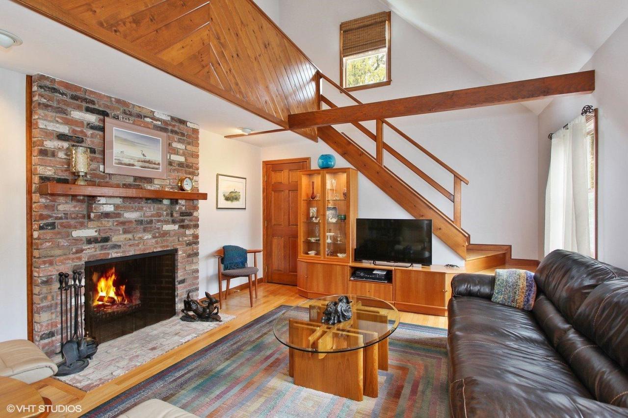 74 Oval Road Chatham, MA 02633 - Photo 2 of 16 a living room with furniture fireplace and flat screen tv