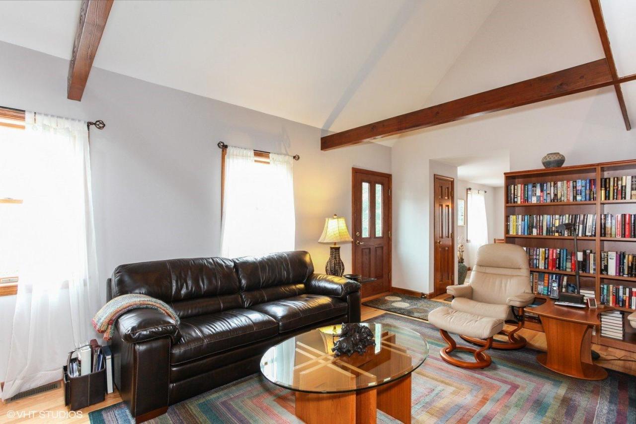74 Oval Road Chatham, MA 02633 - Photo 5 of 16 a living room with furniture a rug and a book shelf