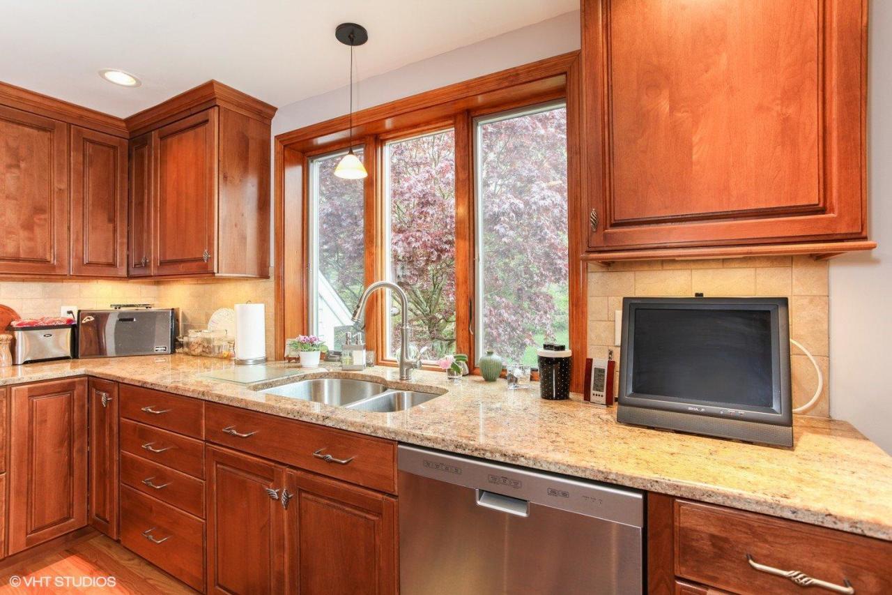 74 Oval Road Chatham, MA 02633 - Photo 8 of 16 a kitchen with granite countertop a sink and a window