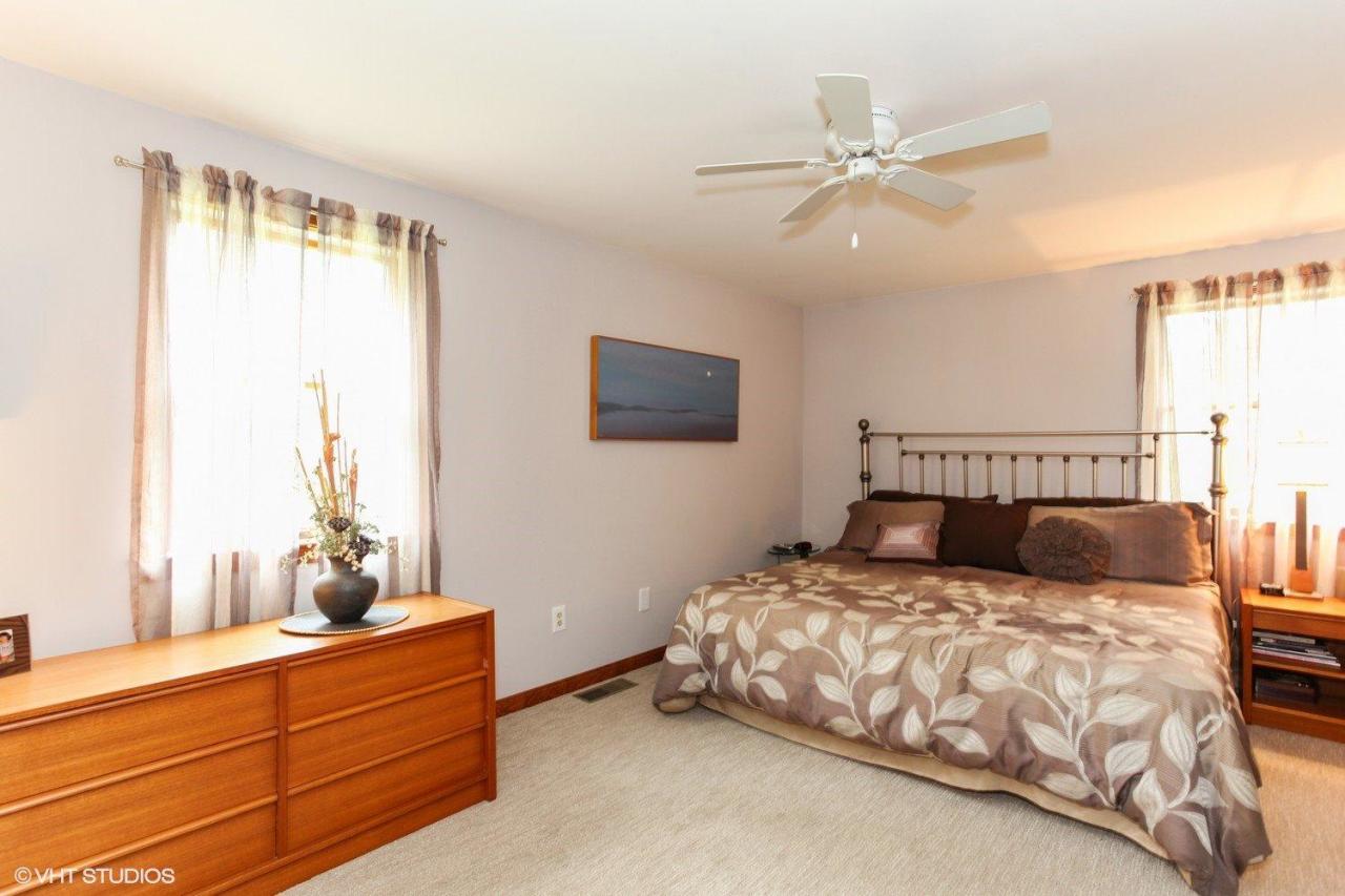 74 Oval Road Chatham, MA 02633 - Photo 10 of 16 a bedroom with a large bed and a window