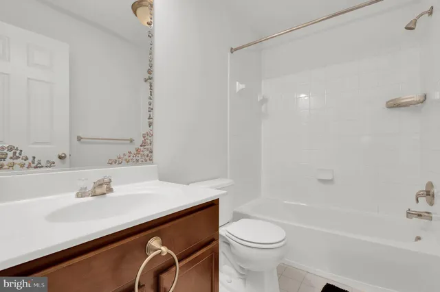 a bathroom with a sink a toilet and a bathtub