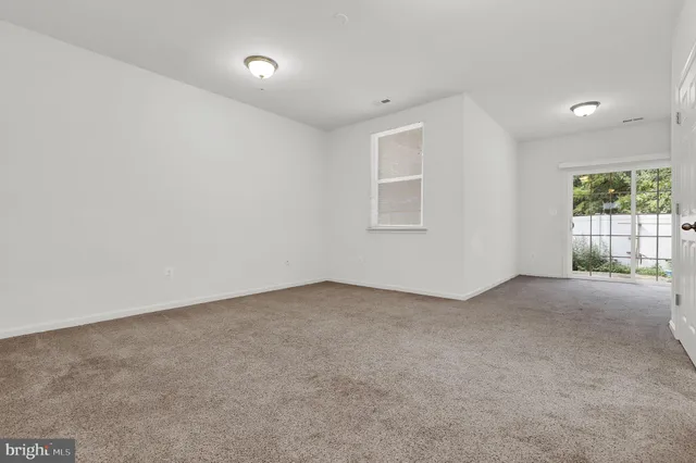 en empty room with windows