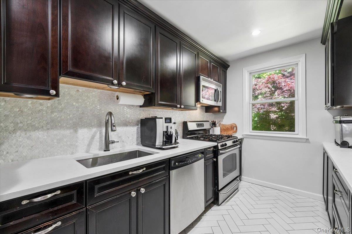 51 Avon Circle, Unit D Rye Brook, NY 10573 - Photo 4 of 30 This renovated kitchen will please home chefs!
