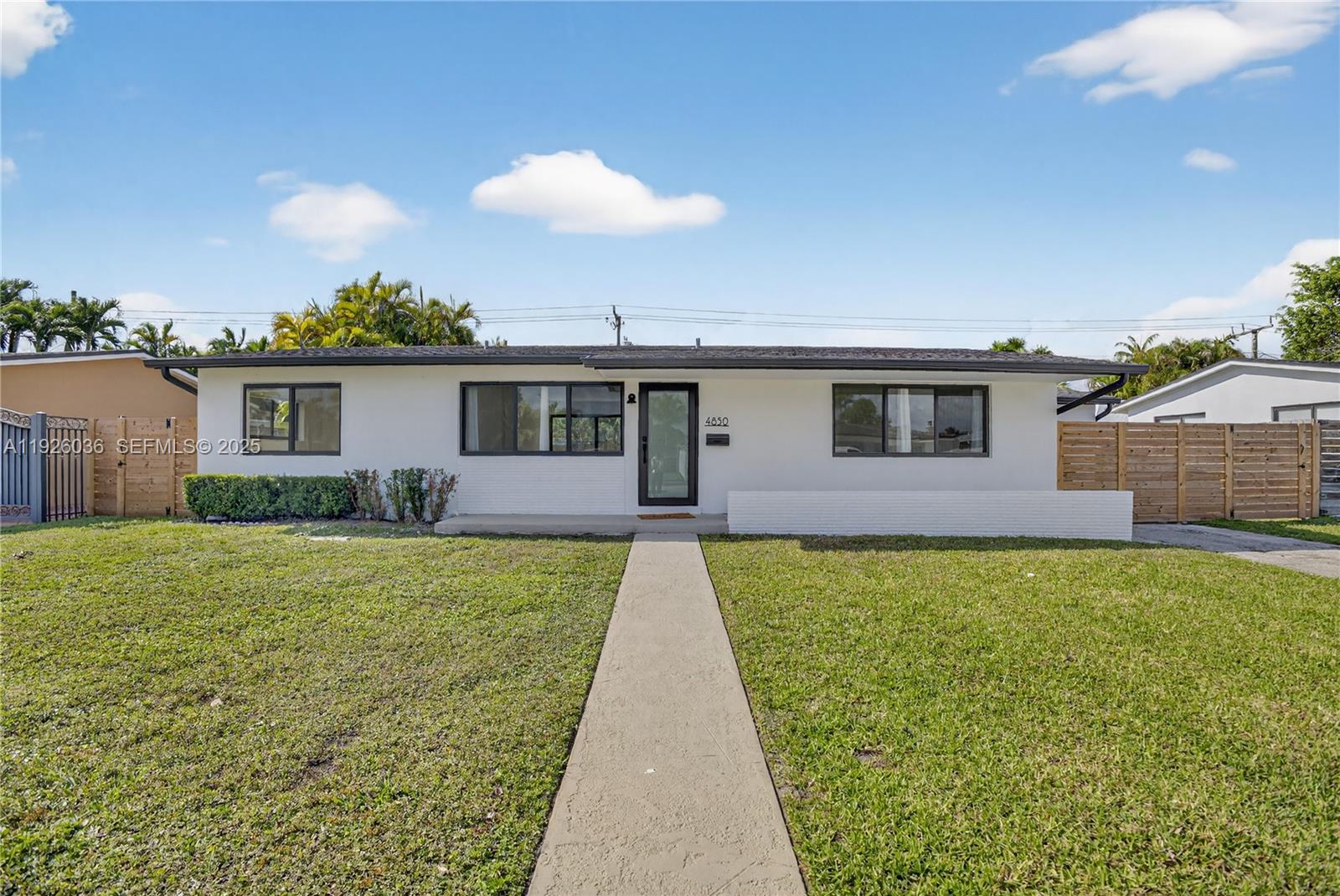 4850 Southwest 93rd Court Miami, FL 33165 - Photo 3 of 25 a view of a house with backyard and a garden