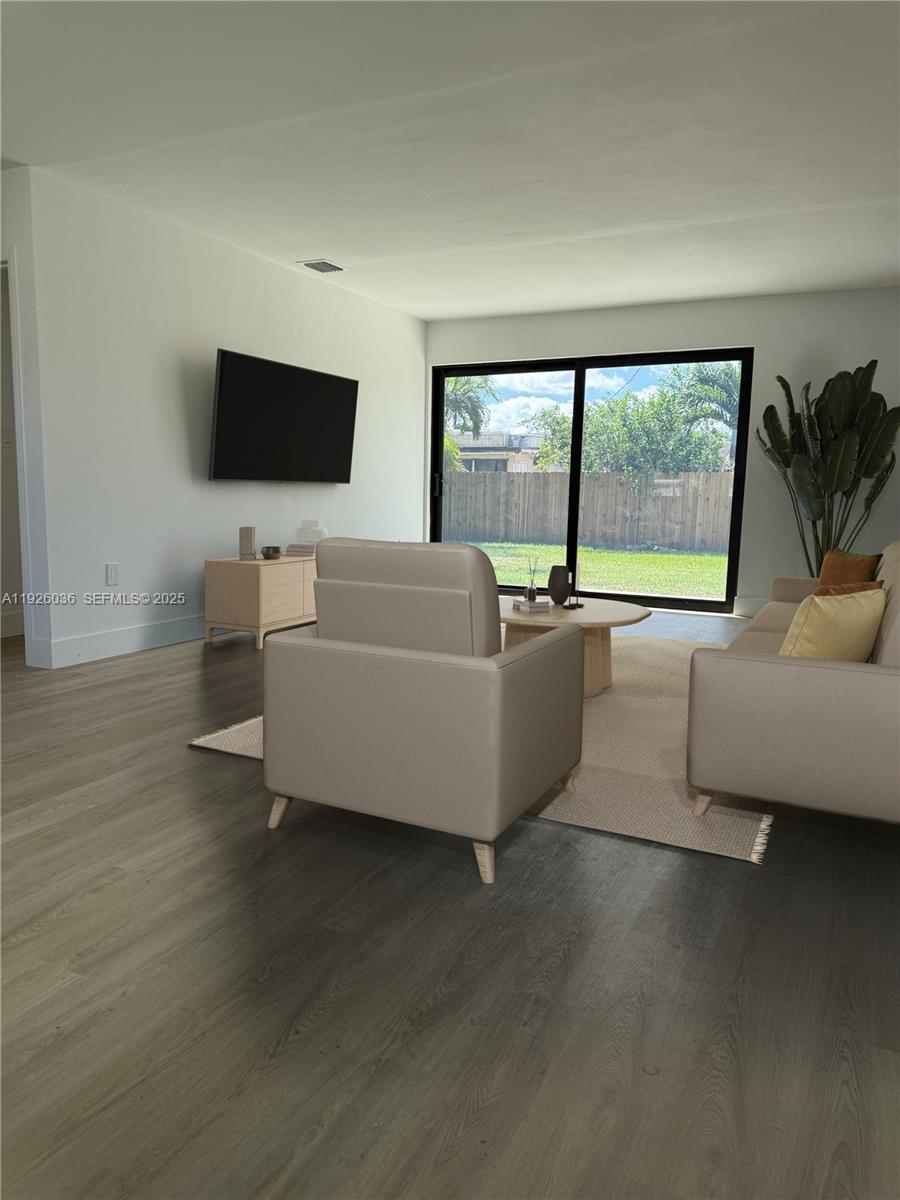 4850 Southwest 93rd Court Miami, FL 33165 - Photo 5 of 25 a living room with furniture and a flat screen tv