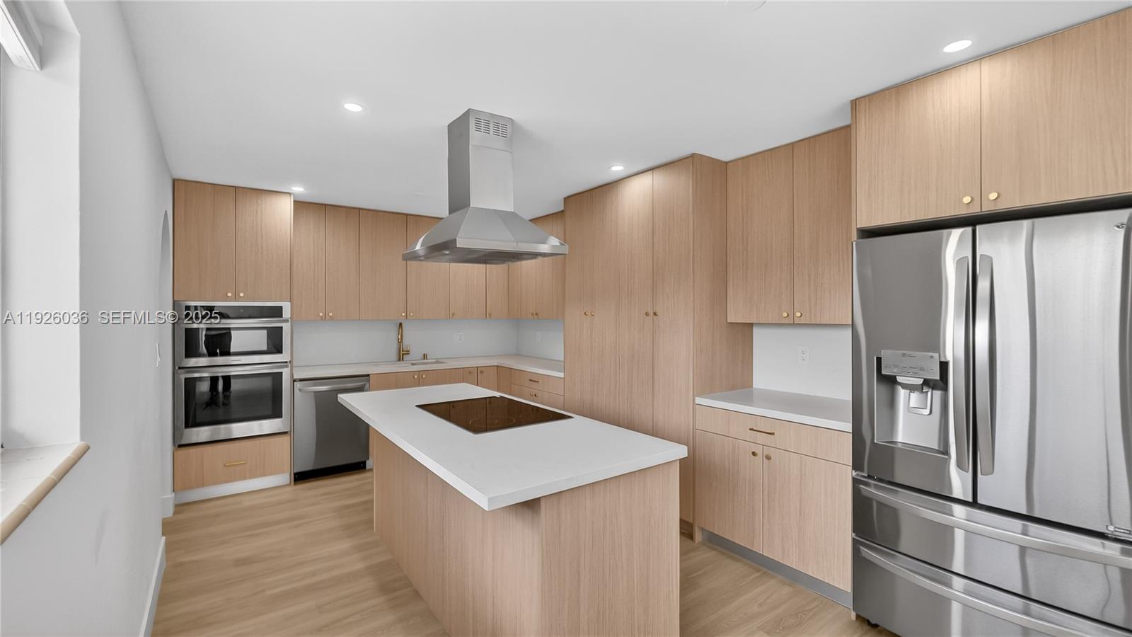 4850 Southwest 93rd Court Miami, FL 33165 - Photo 6 of 25 a kitchen with stainless steel appliances a refrigerator and a sink