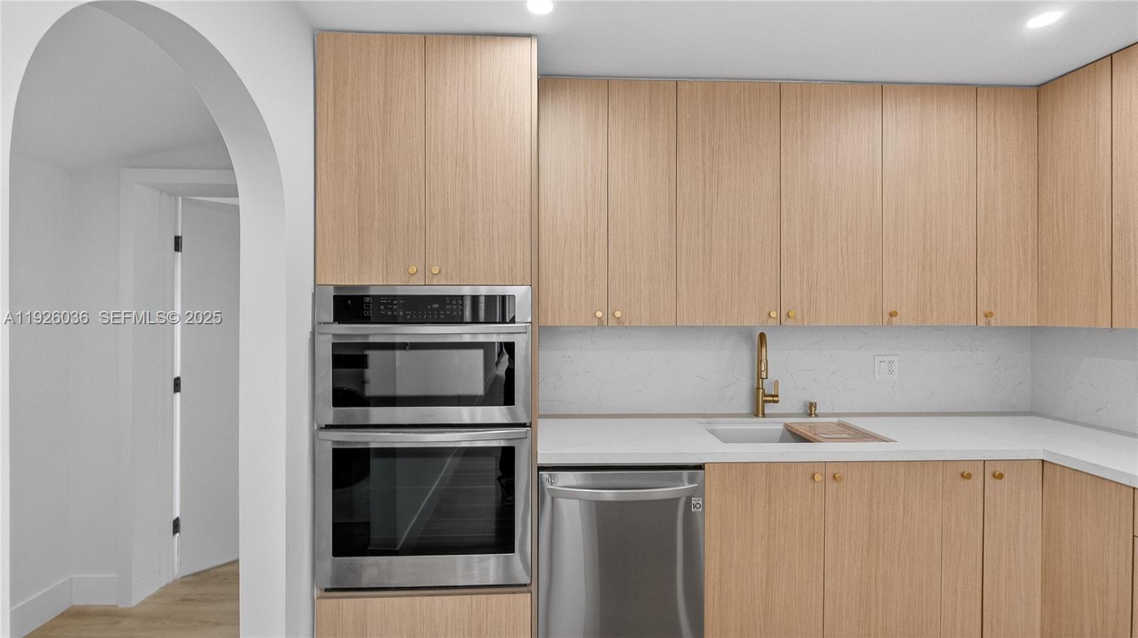 4850 Southwest 93rd Court Miami, FL 33165 - Photo 8 of 25 a kitchen with a stove and a microwave