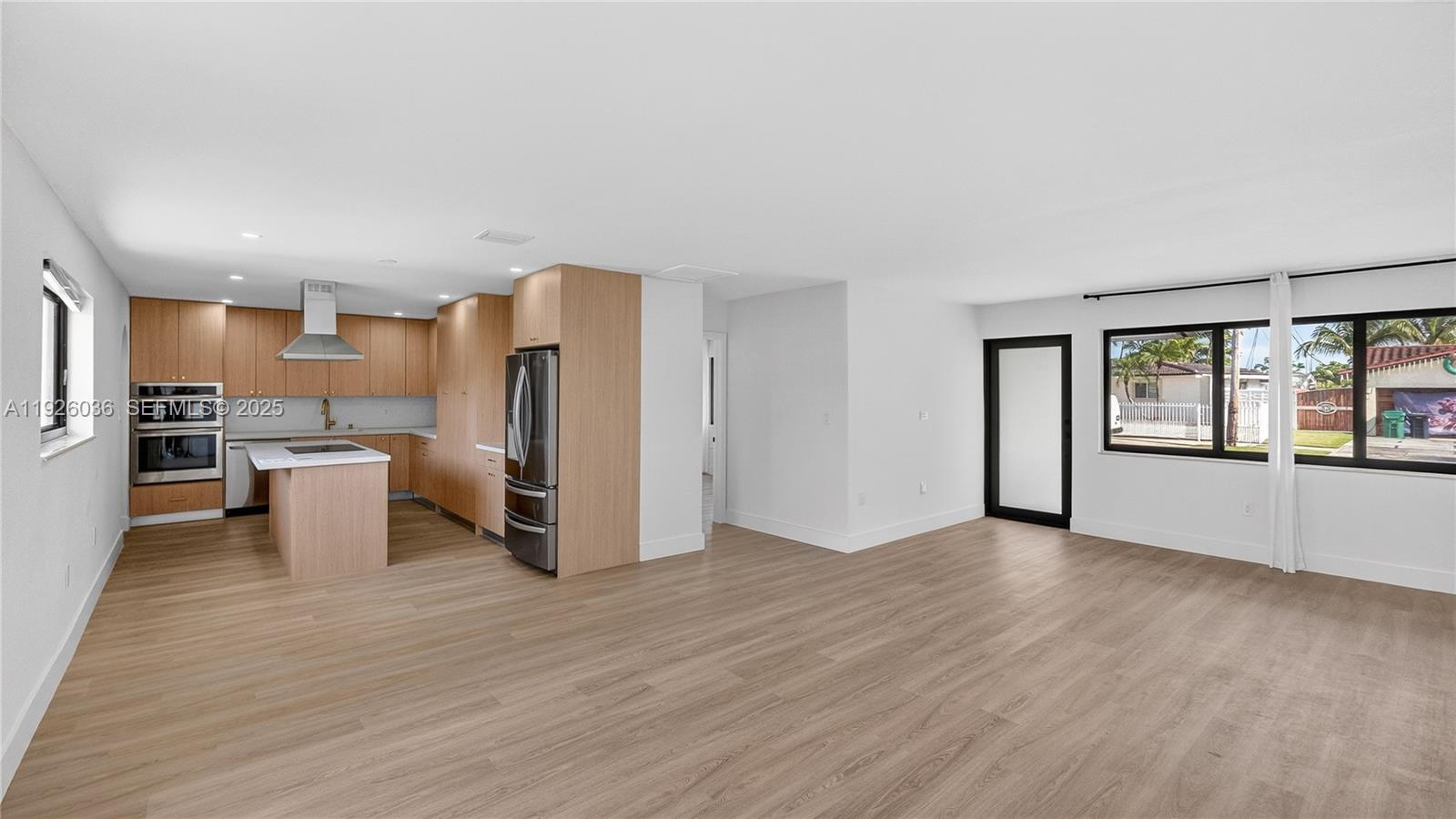 4850 Southwest 93rd Court Miami, FL 33165 - Photo 9 of 25 a view of kitchen with refrigerator stove and wooden floor