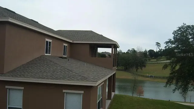 a backyard of a house with lake view and lake view
