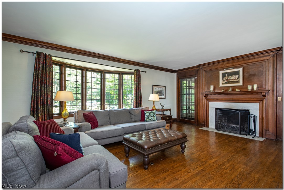 2820 Paxton Road Cleveland, OH 44120 - Photo 5 of 34 Note the beautiful wood feature wall surrounding the wood-burning fireplace.